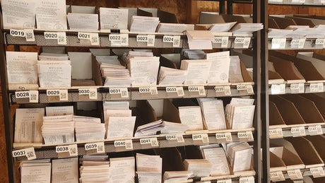 Alliance seed packet inventory organized in numbered in-house fulfillment bays.