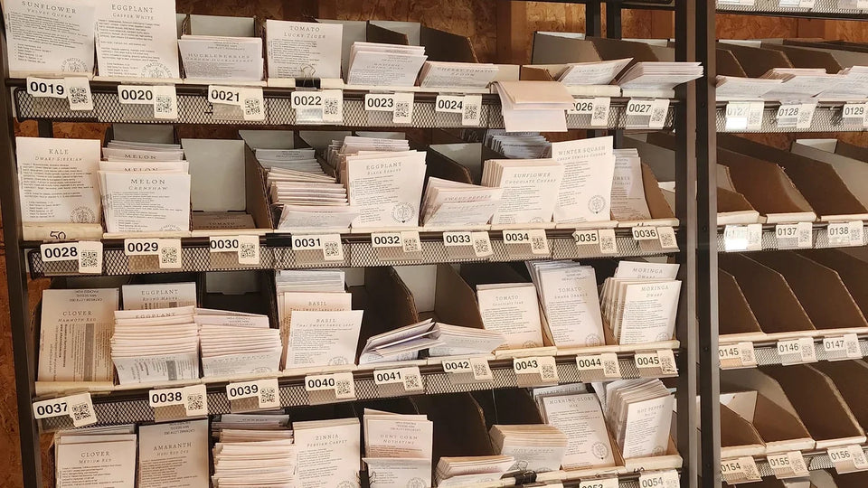 Alliance seed packet inventory organized in numbered in-house fulfillment bays.