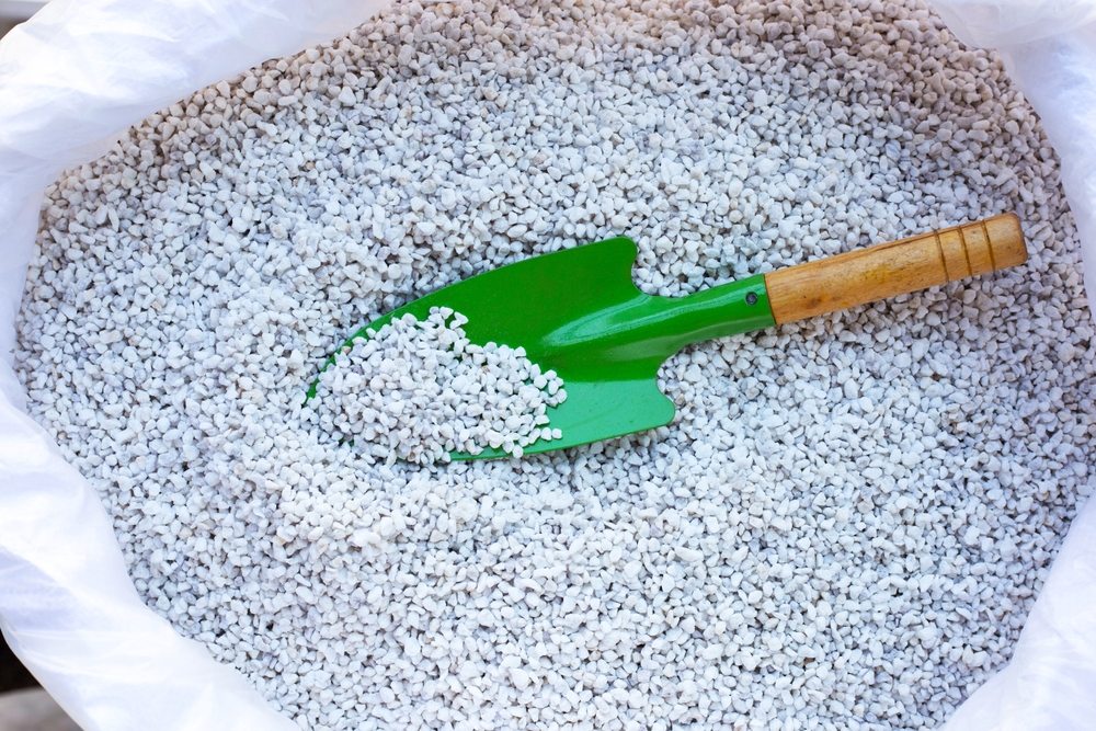 Horticultural perlite in a bag with a small green scoop