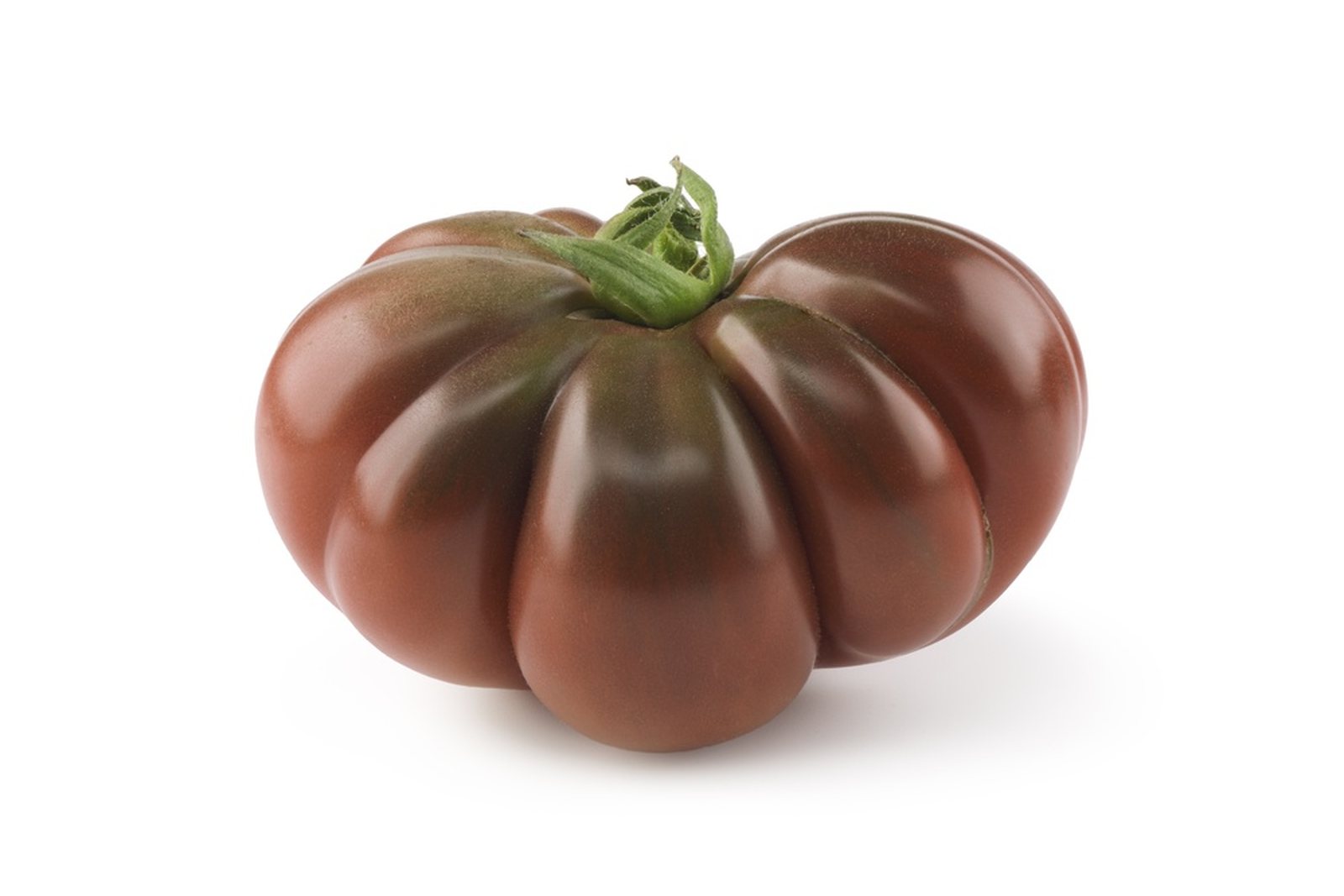 A close view of a dark red-brown ribbed tomato with green shoulders