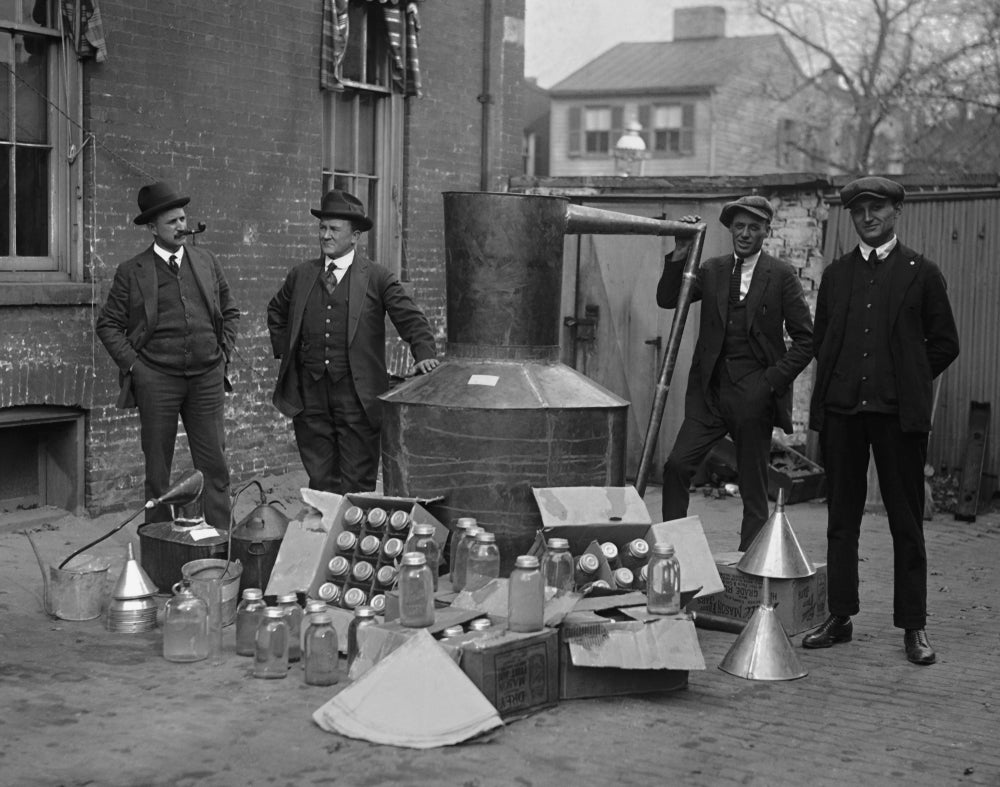 Antique car trunk carrying fruit jars and wooden boxes
