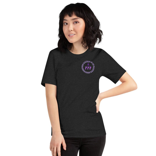 A woman wearing a black t-shirt with a purple logo featuring the SEO keyword "AoNSK Heritage and Harmony Tee" promoting the Merchandise AoNSK 3 Sisters Gender-Inclusive t-shirt by Alliance of Native Seedkeepers.