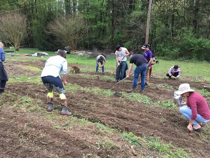 Community members planting corn outside Richmond, Virginia, in 2019