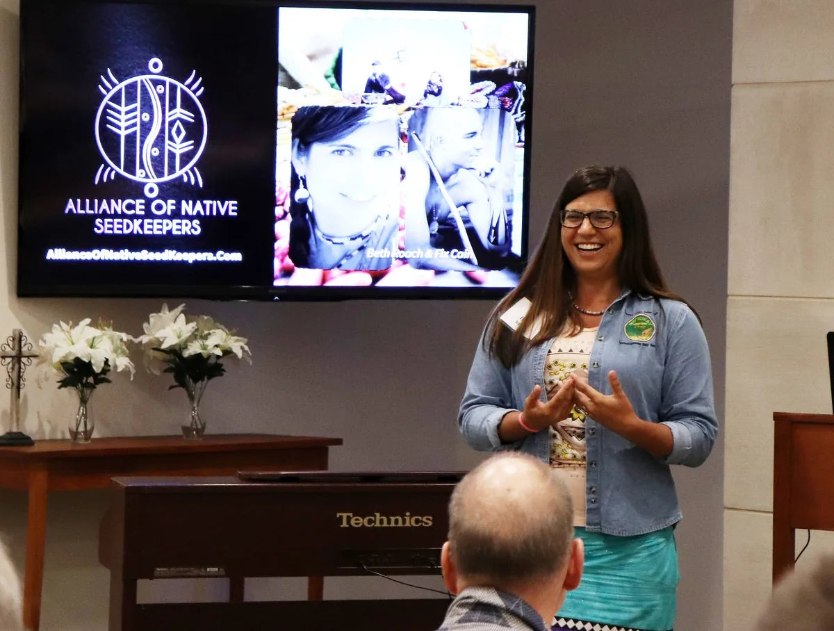 Elizabeth Beth Roach Cain speaking during a public event